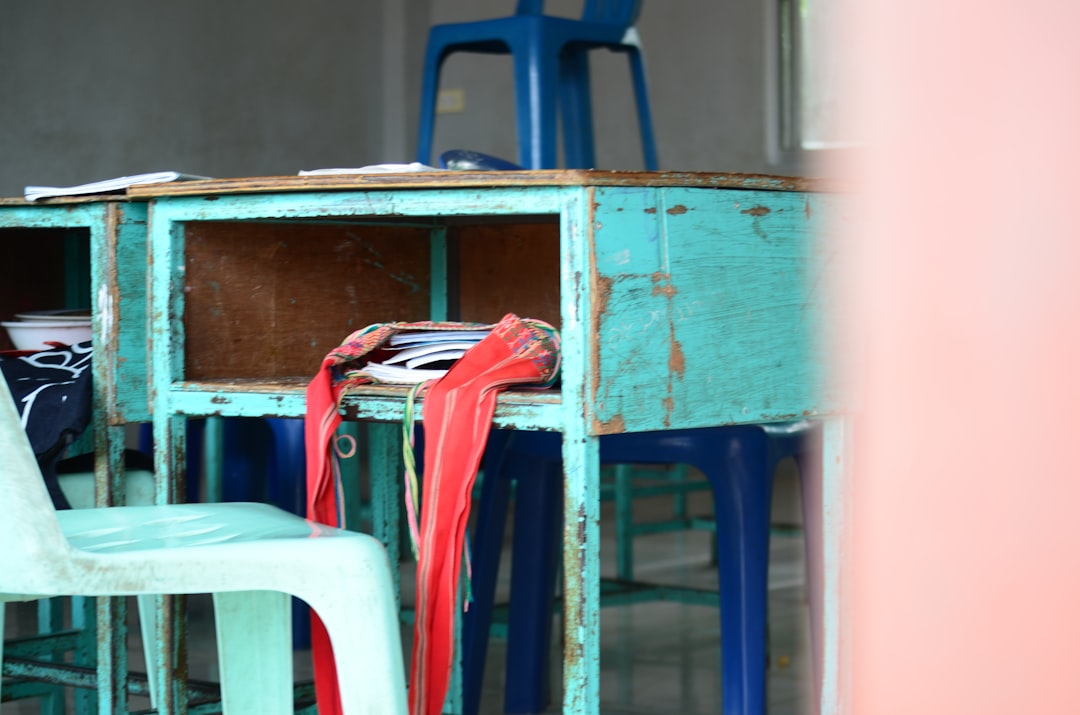 red and white textile on blue wooden shelf